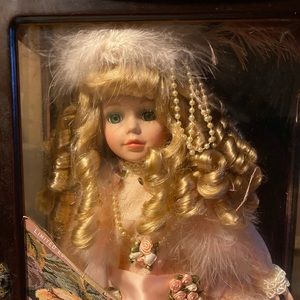 Gently used little ladies porcelain doll